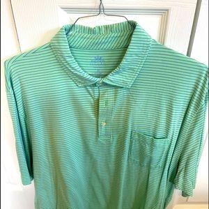 Peter Millar golf green and blue horizontal striped golf shirt.